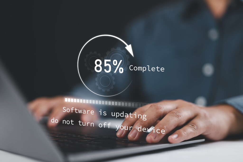 Laptop showing software update progress.