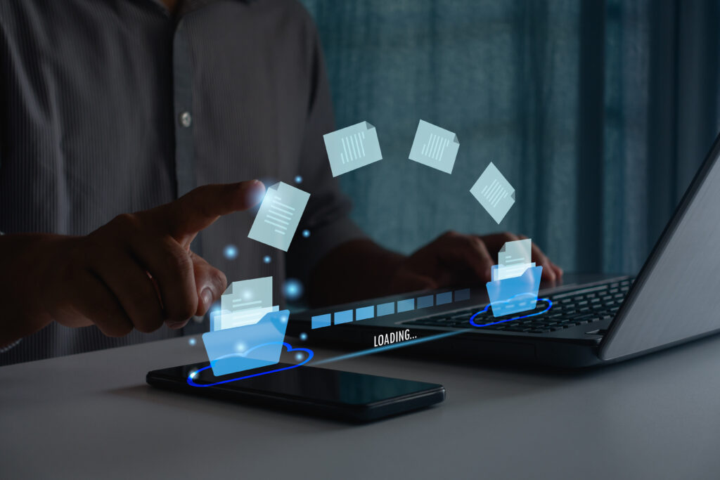 Illustration of data transferring between a smartphone and laptop.