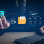 Business professional using a laptop with a digital document approval interface, illustrating data backup best practices, verification, and secure documentation before data destruction.