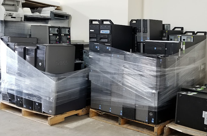 Palletized and wrapped desktop computers.